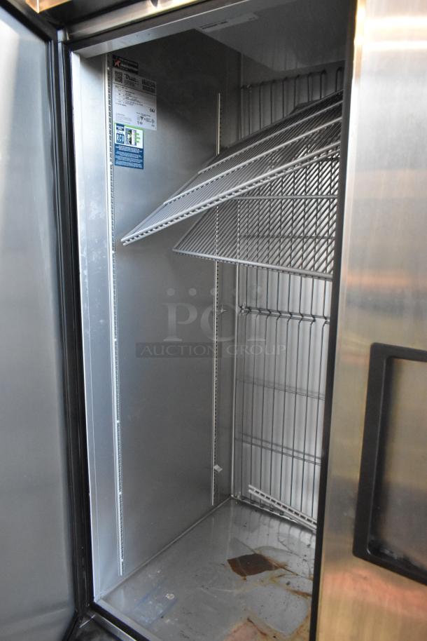 2019 True T-49F-HC 2 Door Commercial Freezer, shown open, with shelves, minor interior wear, on casters, 115V, 1 Phase.
