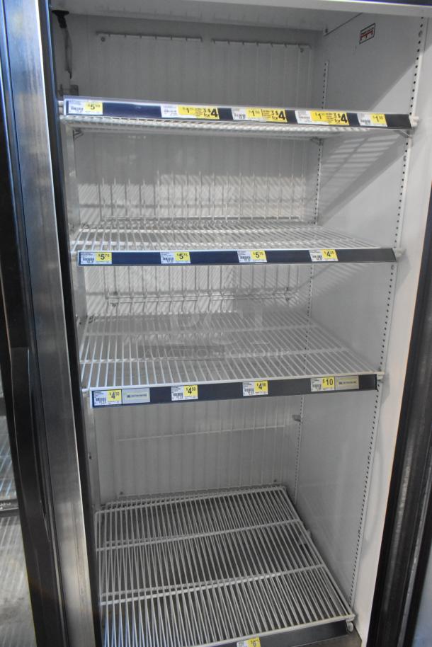 2019 True GDM-49-HC cooler merchandiser, 2-door, chrome shelves, excellent condition, 115V, 1 Phase, interior price tags visible.