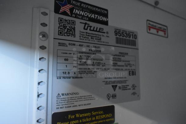 Label of 2019 True GDM-49F-HC Commercial Reach-In Cooler, showing model, compressor info, freon type, and warnings.