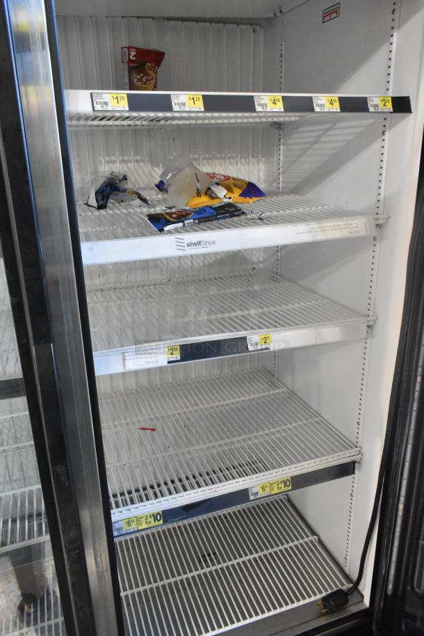 2019 True GDM-49F-HC commercial 2-door reach-in freezer merchandiser, visible shelving, some wear, 115/208-230 volts.