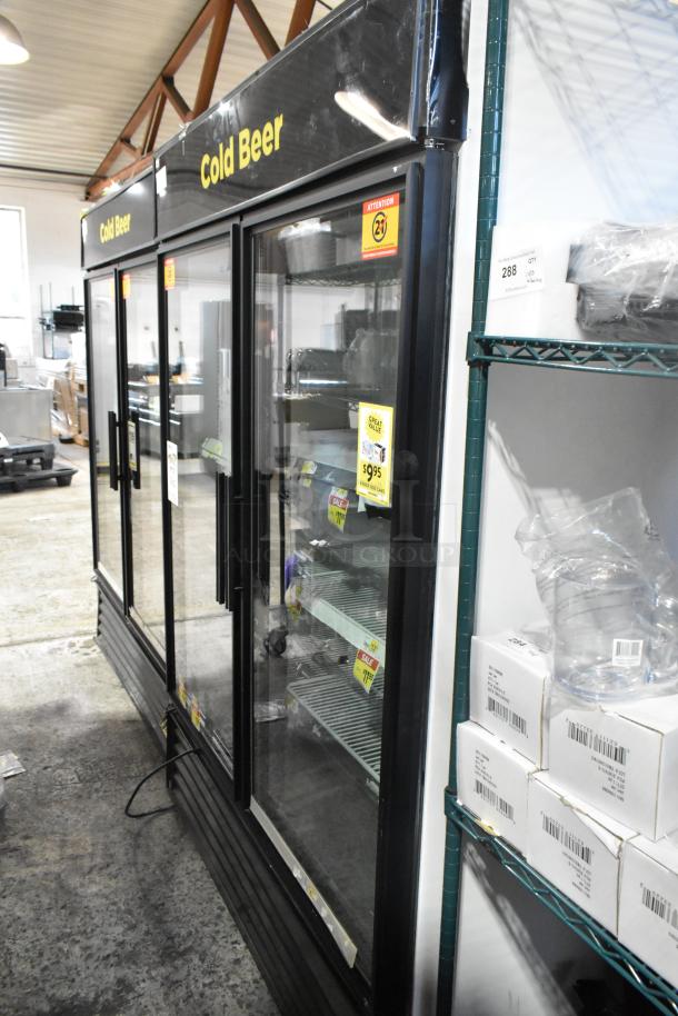 2016 True GDM-49-HC commercial cooler with two glass doors, black exterior, 115V, 1 phase, used condition, "Cold Beer" signage.