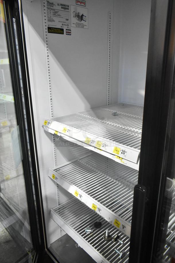2016 True GDM-49-HC Commercial 2 Door Reach In Cooler; shelves, tags visible; 115V, 1 Phase; model details tagged inside.