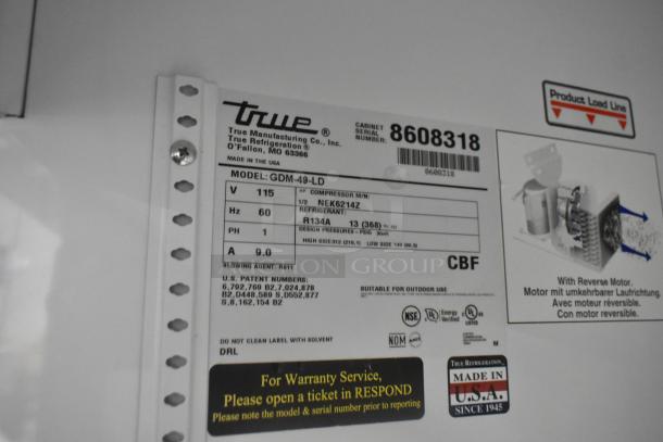 Label of 2016 True GDM-49-HC Cooler, showing model, voltage 115V, phase 1, refrigerant R134A, and serial number 8608318.