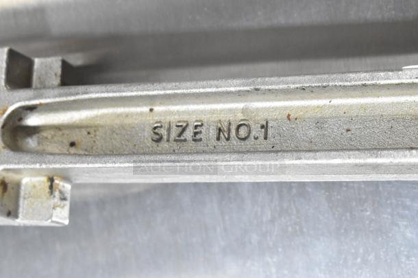 Edlund Commercial Can Opener, Size No. 1, metal construction, visible wear, sturdy design for heavy-duty use.