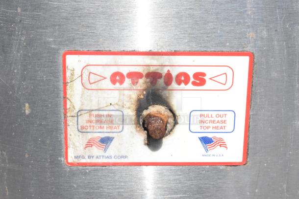 Attias 2 JS 6-18 commercial gas pizza oven label, showing brand and heat control instructions. Condition: used.