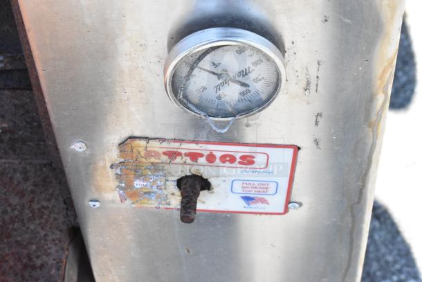 Attias 2 JS 6-18 commercial gas pizza oven, featuring a temperature gauge, visible wear on label, 200,000 BTU, single deck.