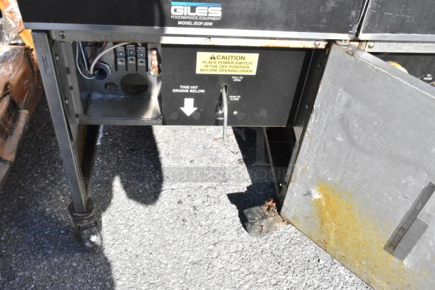 Giles EOF-24 stainless steel 3-bay fryer with EOF-BIB dumping station, 480V, 3-phase, visible wiring, and caution label.