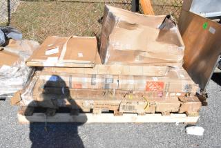 6 new scratch and dent items on a pallet, including a heated shelf warmer. Damaged boxes, visible shipping labels.