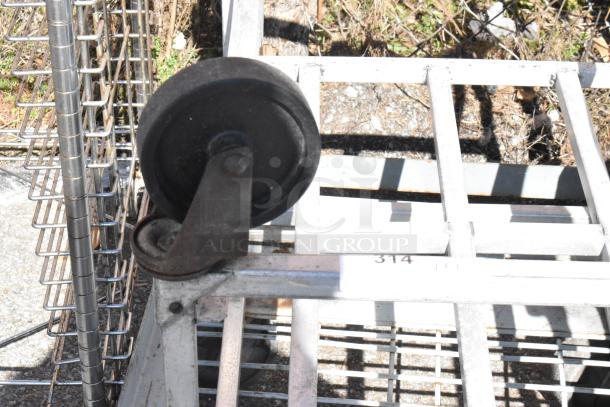 Two commercial items: a 2-tier dunnage rack and a flat cart with casters. Sturdy metal grid design, used condition.