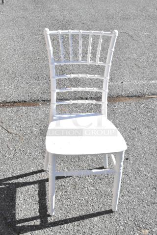 White resin Chiavari chair from Lancaster Table & Seating, new with minor scratches. Elegant design, durable build.