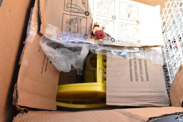 Cardboard boxes containing 13 brand new scratch and dent items, including yellow components and assembly instructions visible.