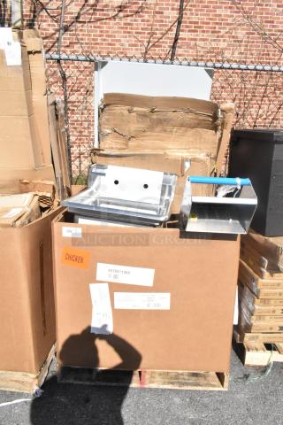 Cardboard boxes with a stainless steel sink and shortening shuttle, marked as chicken, new yet scratched or dented.
