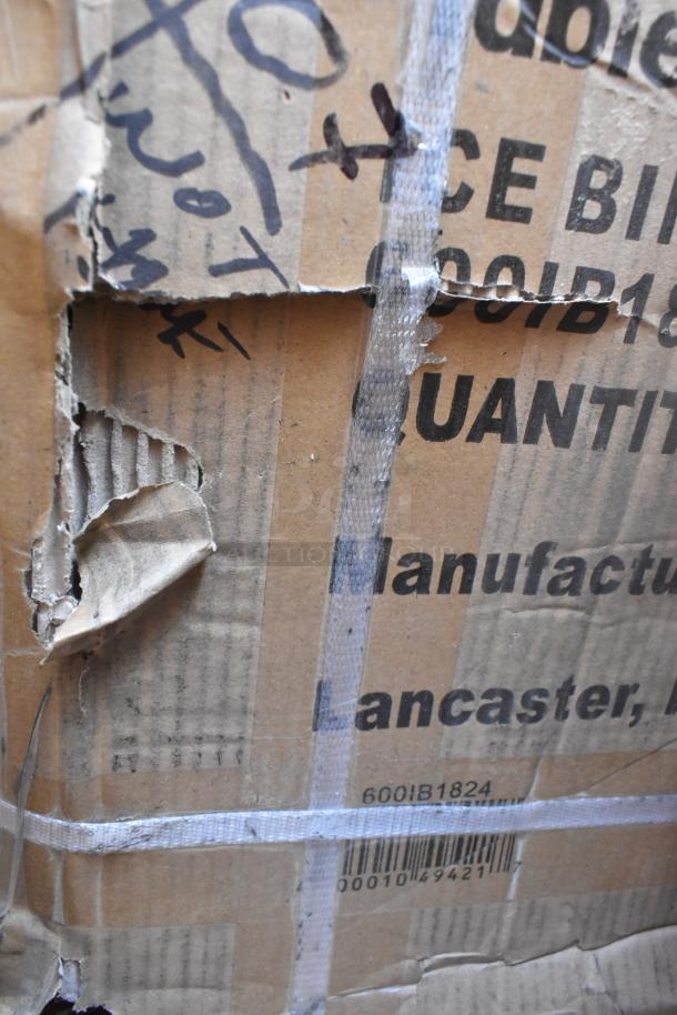 Damaged cardboard packaging labeled "Lancaster" with SKU 600IB1824, containing scratch and dent items including a sink.