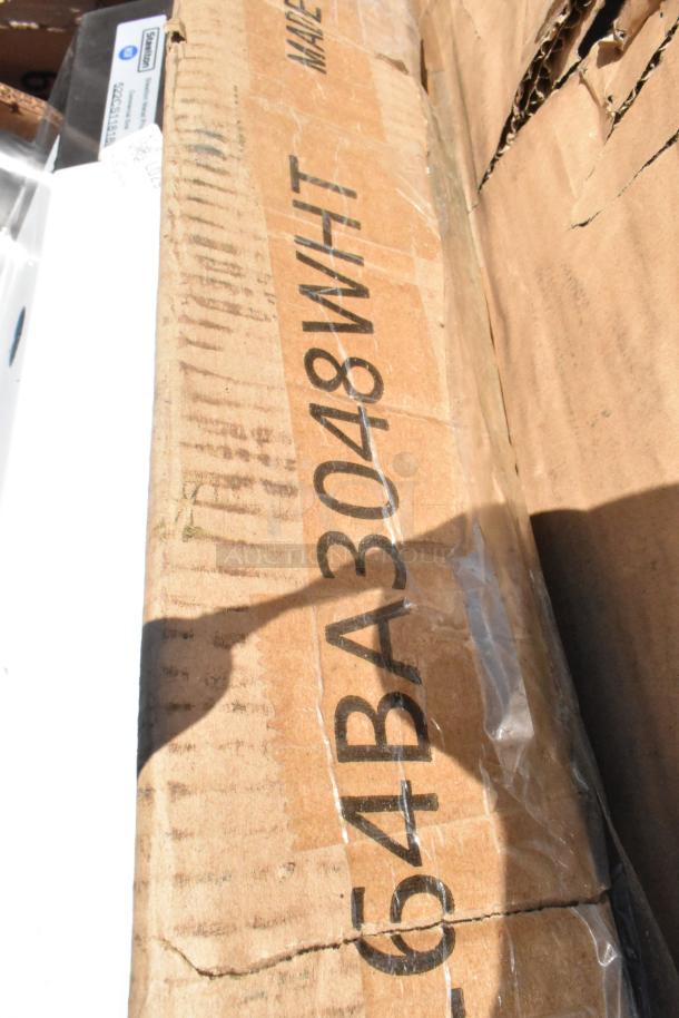 Cardboard box showing "64BA3048WHT" marking, indicating part of a lot including a new sink and shortening shuttle.