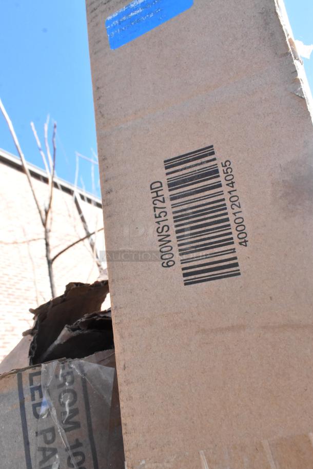 Cardboard box with barcode and marking "600WS1572HD," part of a lot including shelf and tables, in scratch and dent condition.