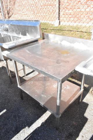 Regency 600TSB3036S commercial table with under shelf, stainless steel, sturdy build, used condition, minor surface wear.