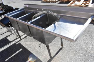 Commercial 3 bay stainless steel sink with left side drain board, features flexible faucet. Ideal for restaurant use.