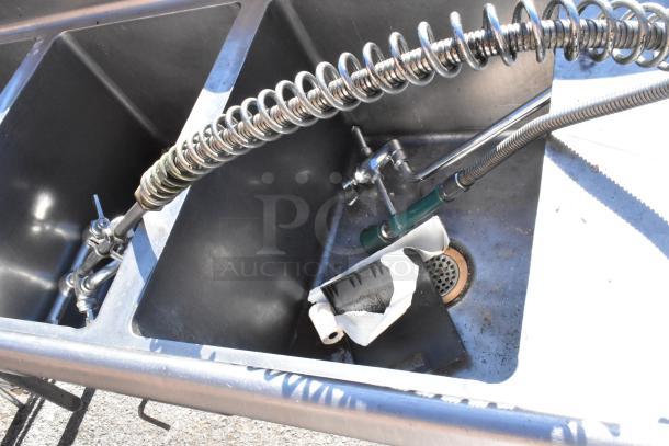 Commercial 3 bay sink with left side drain board, stainless steel. Features coil spring faucet, used condition.