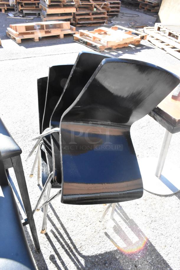 Set of 14 black chairs with sleek design; includes 2 bar height, 8 dining height. Good condition, visible shine and sturdy frames.