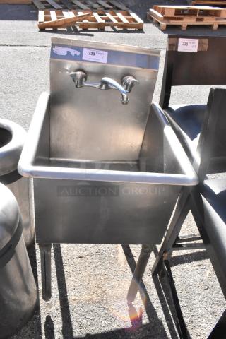 Stainless steel commercial single bay sink with wall-mounted faucet, auction tag labeled "339 Qty 1," in used condition.