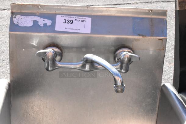 Commercial single bay sink with dual-handle faucet, stainless steel, slight surface wear, auction tag visible.