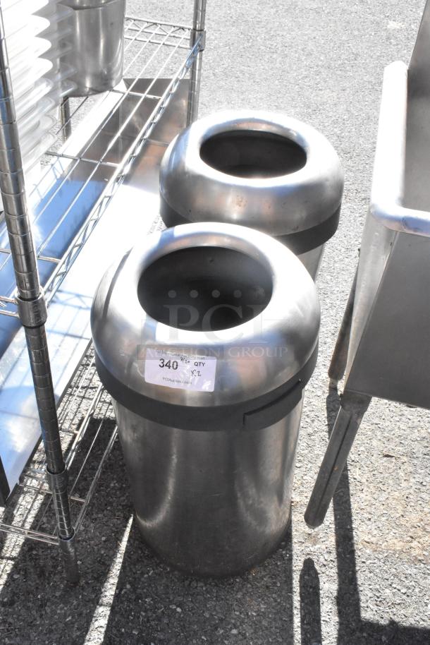 Two chrome finish trash can shells with open tops, good condition, auction tag visible, bid doubles item quantity.