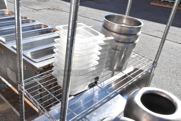 Chrome finish 3-tier wire shelving unit with bins and metal containers. Dismantling required for transport.