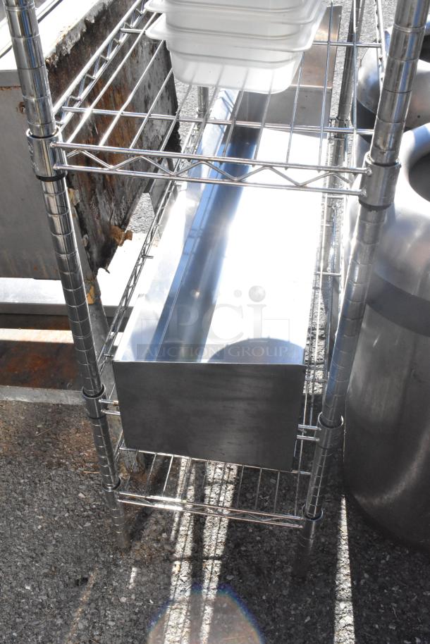 Chrome 3-tier wire shelving with bins; sturdy construction. Buyer must dismantle. Consider freight charges.