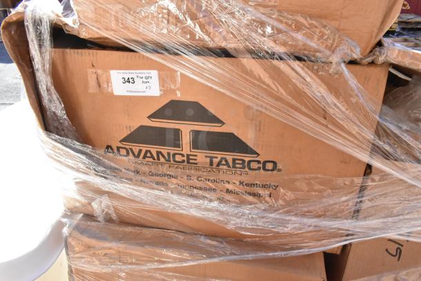 Cardboard boxes with "Advance Tabco" logo, containing brand new scratch and dent sinks. Auction tag shows lot number 343.