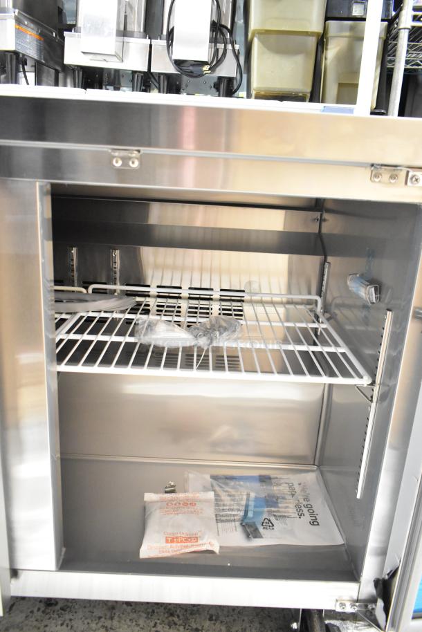 Brand new Avantco 178SSUC48RHC undercounter cooler, 2-door, stainless steel, scratch and dent, 115V, 1 phase, interior view.