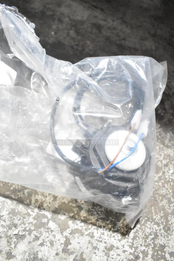 Plastic-wrapped electrical component labeled "BRAND NEW SCRATCH AND DENT." Item shows minor packaging wear.