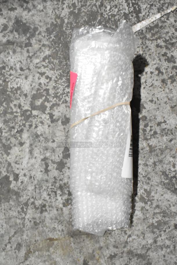 Auction item wrapped in bubble wrap, labeled "Brand New Scratch and Dent," with barcode visible.