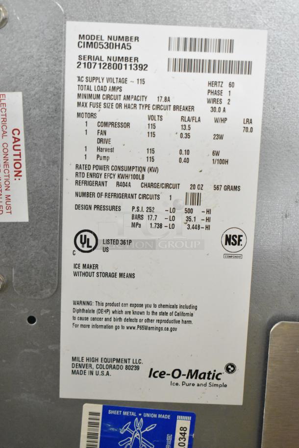 2021 Ice-O-Matic CIM0530HA5 commercial ice head on bin, 115V, 1-phase. Label shows specs and safety warnings. Made in USA.