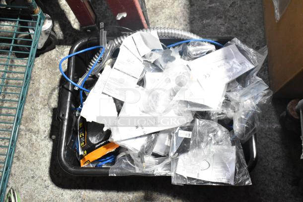 Lot of various items including Flojet 20578007C hardware, cords, and other miscellaneous parts, in used condition.