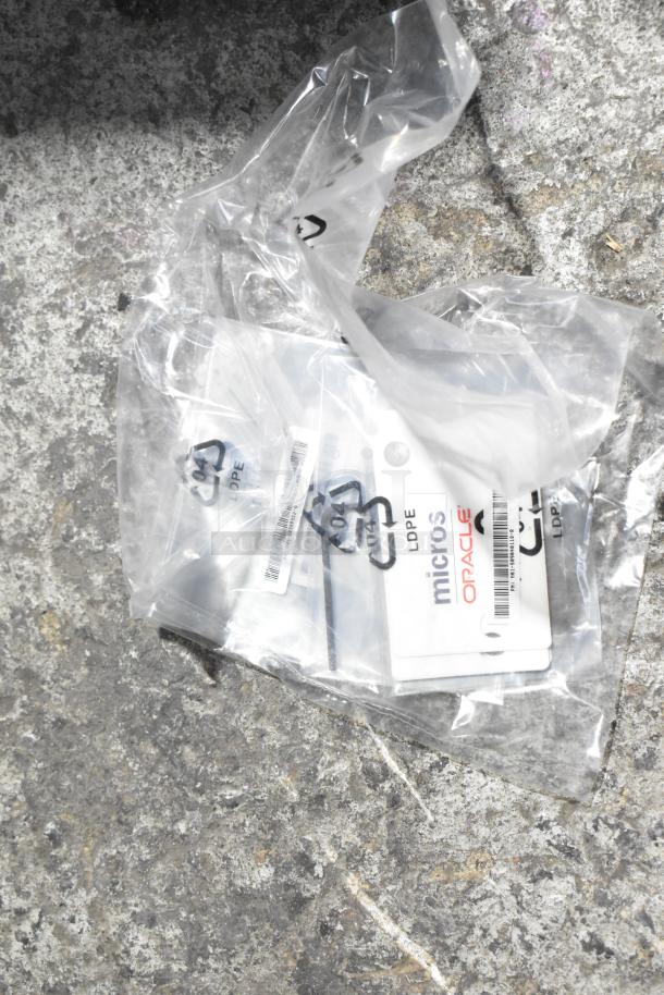 Mixed lot including Flojet 20578007C hardware, cables, and Oracle Micros ID cards in plastic. Used condition.