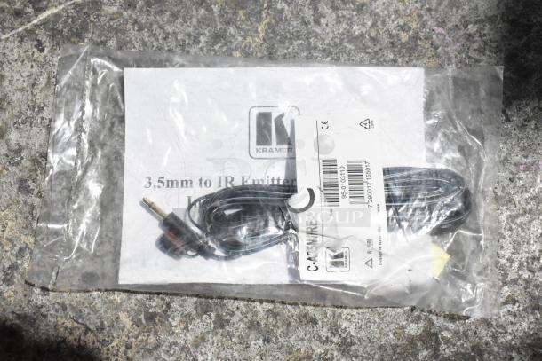 Lot of various items in packaging, including a 3.5mm to IR emitter cord, Kramer logo visible, sealed condition.