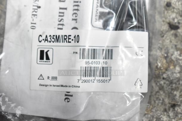 Lot of various items including packaged Kramer C-A35M/IRE-10. Labels show part numbers and origin, indicating new condition.