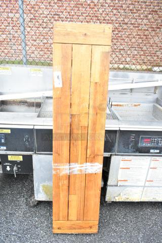 Wooden butcher block tabletop with legs, vertical slat design, in good condition. Features visible tag labeled "307."