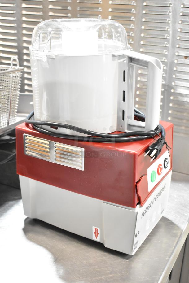 Brand new Robot Coupe R2N food processor, 3 qt gray bowl, continuous feed, 2 discs, 1 hp, 120V, minor scratches and dents.