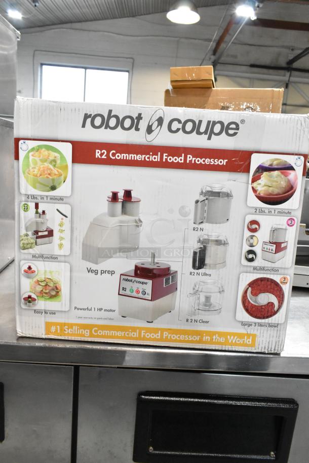 Robot Coupe R2N food processor box, 3 Qt. gray bowl, 1 hp, continuous feed, 2 discs, 120V, new with minor scratches.
