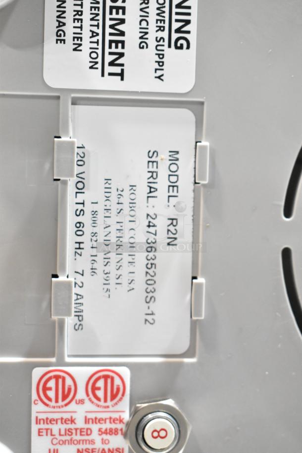 "Robot Coupe R2N food processor label showing model, serial number, 120 volts, and ETL certification."