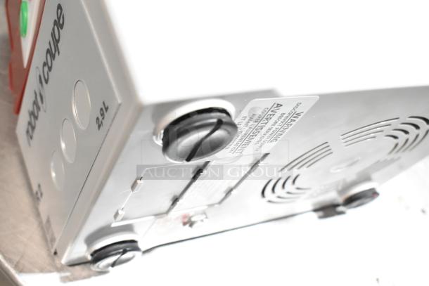 "Robot Coupe R2N Food Processor, 3 Qt gray bowl, continuous feed, 1 hp, 120V, brand new, visible warning label."