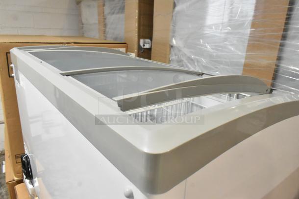 Brand new Excellence 215VB5LHC commercial display freezer, 12.9 cu. ft., curved lid, minor scratches, 115V, 1 phase.