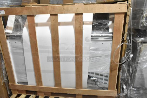 Brand new Avantco 178CPW68HC ice cream dipping cabinet in white, 12 tub capacity, 115V, showing slight dents, crated for shipping.