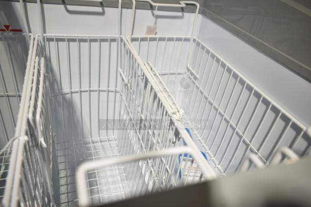 Excellence 215VB5LHC commercial display freezer, 12.9 cu. ft., curved lid, brand new scratch and dent, interior view.