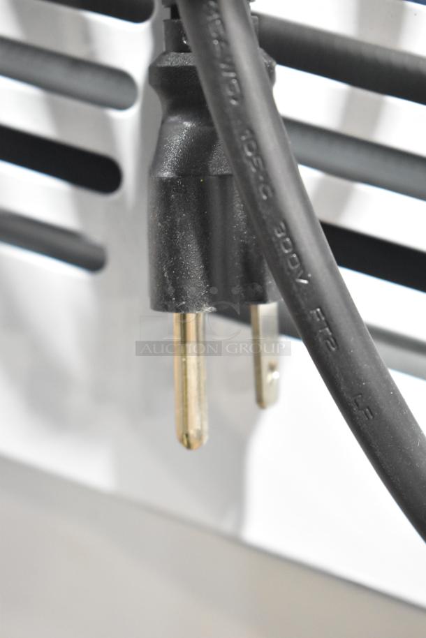 Close-up of power plug on Avantco 178CPW68HC Deluxe Ice Cream Dipping Cabinet, 115V, 1 Phase, brand new scratch and dent condition.