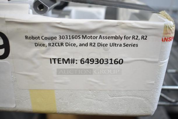Alt text: Brand new Robot Coupe 303160S motor assembly for R2 series, item# 649303160, with visible label and minor dents.
