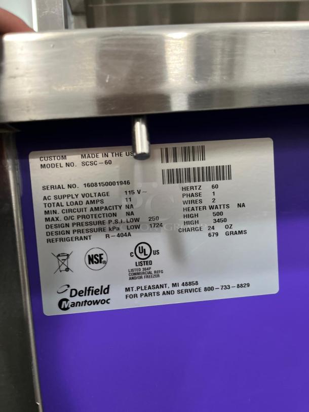 Delfield SCSC-60-EFP 60" refrigerated food prep table label showing specs: 115V, 11A, R-404A refrigerant, NSF listed.