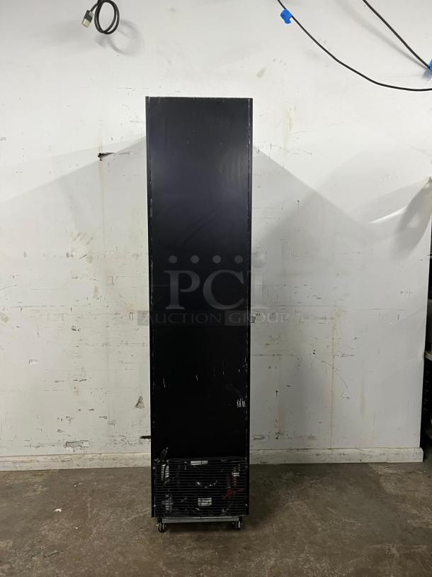 YUKON USF-175BLK commercial single glass door freezer, black exterior, visible shelving inside, used condition.