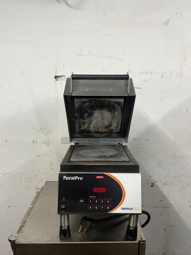 Nemco 6900-208-GF Panini Press, single commercial model, grooved/smooth plates, 208v, buttons visible, signs of wear.